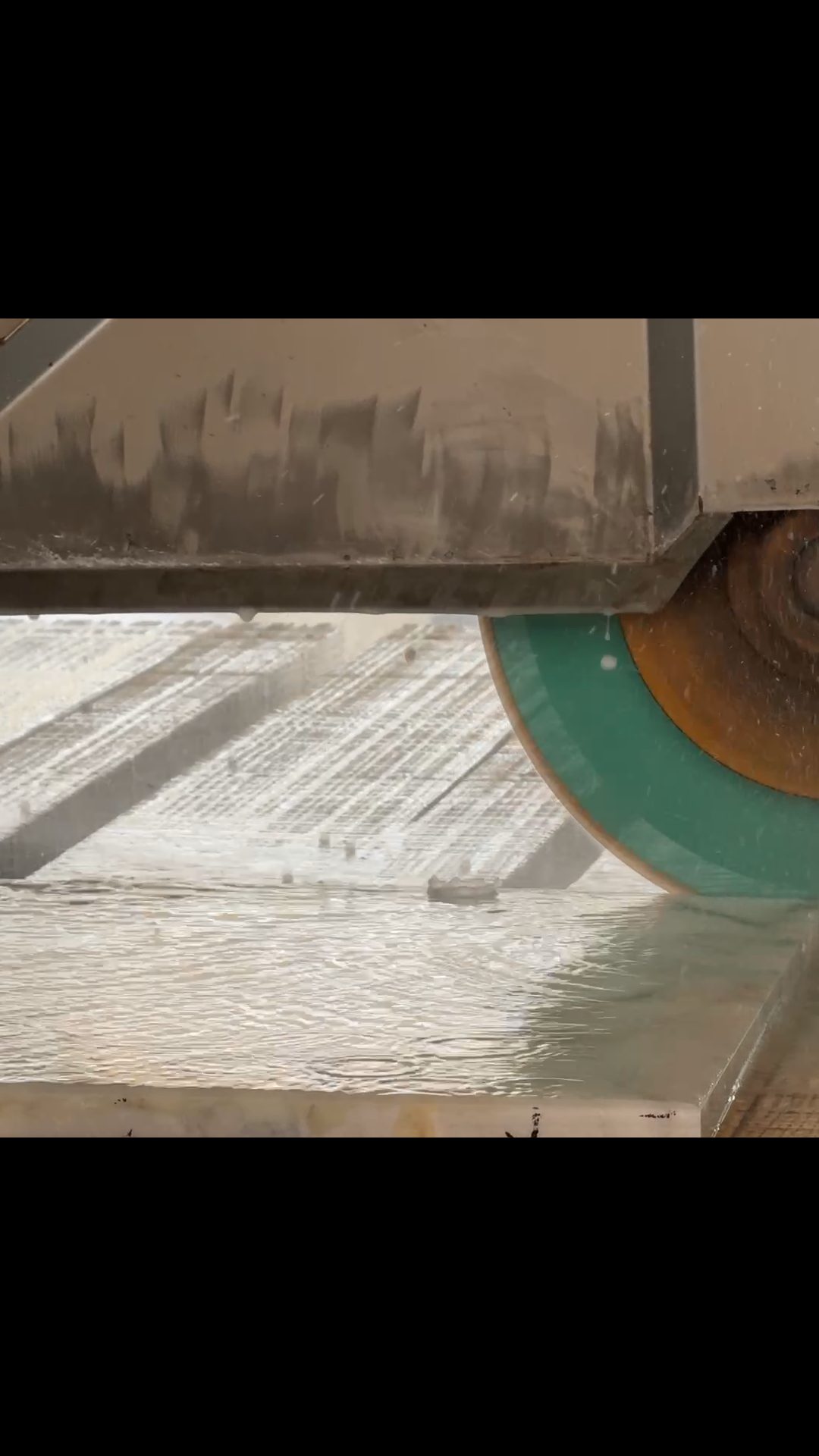 Craftsman hand-finishing a stone edge in the Metaform factory